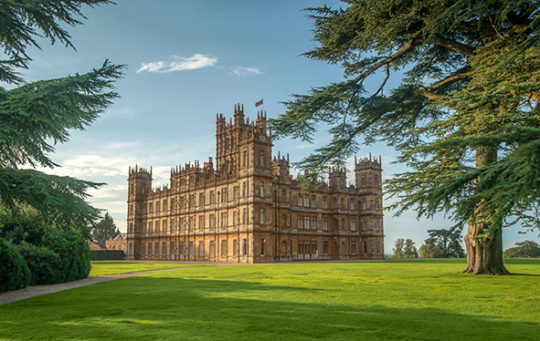 Highclere Castle with trees in foreground