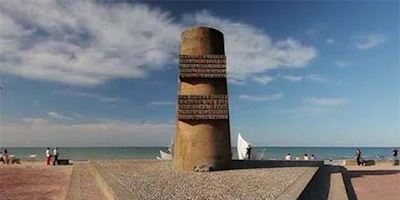 A memorial statue on the beach at Normandy.