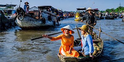Karine and guest on a traditional Vietnamese river boat